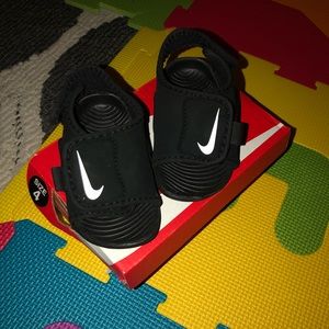 Gently used baby nike slides.